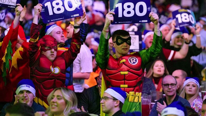 Fans in fancy dress enjoy the darts at the Alexandra Palace. Photograph: john Walton/PA