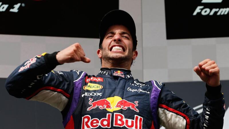Australian driver Daniel Ricciardo of Red Bull Racing celebrates on the podium after winning the Hungarian Grand Prix at the Hungaroring track in Mogyorod near Budapest, Hungary, 27 July 2014. EPA/VALDRIN XHEMAJ