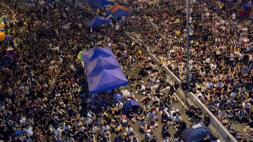 Demonstrators gather outside the Central Government Offices in the Admiralty business district of Hong Kong. Photograph: Brent Lewin/Bloomberg