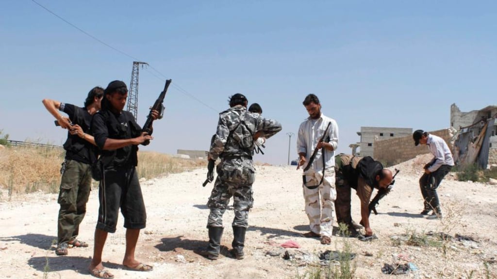 Free Syrian Army fighters check the amount of ammunition they have for their weapons near Aleppo international airport. With an impending military attack on Syria now all but certain, UN general secretary Ban Ki-moon urged western leaders to await the outcome of the four-day missionto to determine the use of  chemical weapons, which is expected to finish tomorrow.