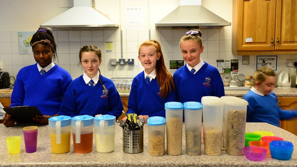 Sixth class students help serve the healthy breakfast club ‘Rise ‘n’ Shine’ and lunchbox initiative for pupils at St Eithne’s in Edenmore, Raheny, Dublin. Photograph: Dara Mac Dónaill