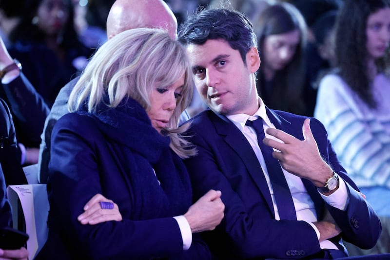 France's then education and youth minister Gabriel Attal speaks with French first lady Brigitte Macron at an event in Paris in November. Photograph: Ludovic Marin/AFP via Getty Images