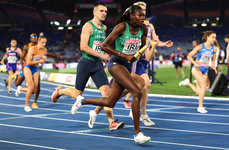 The first baton change: O'Donnell hands over to Adeleke. Photograph: Morgan Treacy / Inpho