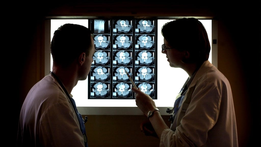 Doctors examine an X-ray in the orthopaedic unit of the Mater hospital in Dublin. Older consumers are likely to have a greater requirement for full orthopaedic cover, the HIA report says. Photographic: Bryan O’Brien