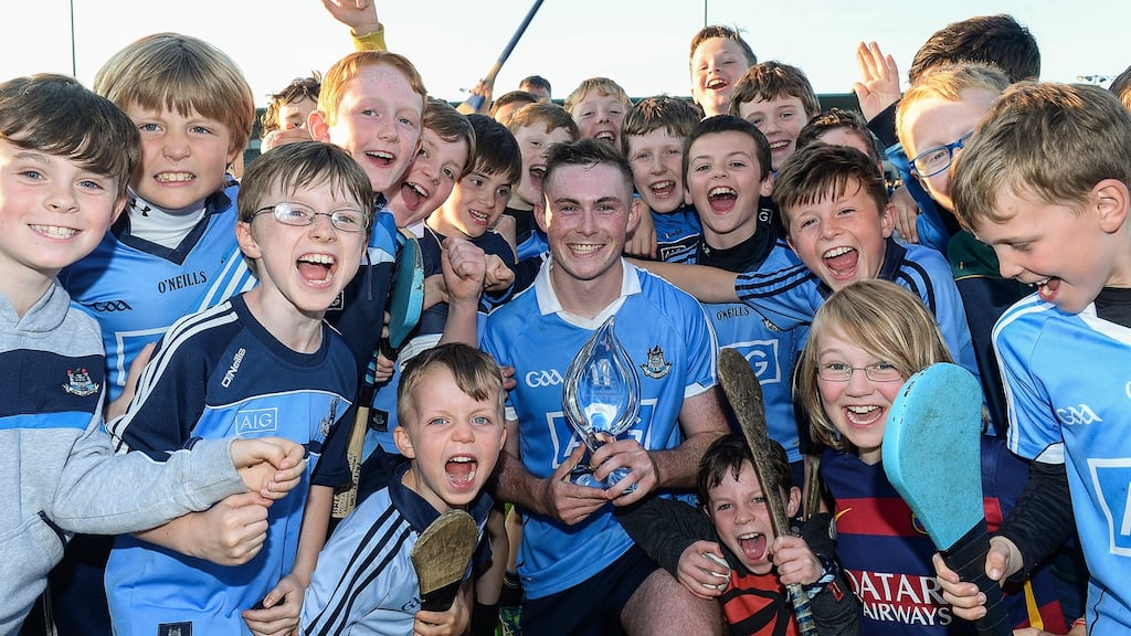 Man of the match Chris Bennett of Dublin with his trophy and young supporters after the Leinster U21 semi-final win over Westmeath at Parnell Park. Photograph: Matt Browne/Sportsfile