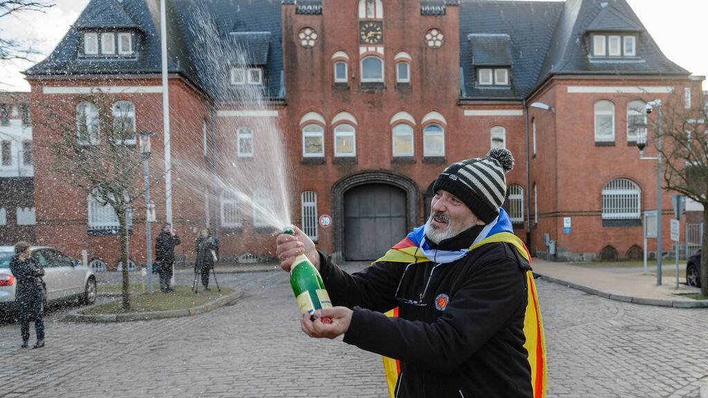 A supporter of Catalan independence leader Carles Puigdemont celebrates in front of the prison in Neumünster where he has been held for almost two weeks, after a German court dismissed the rebellion charge in the European Arrest Warrant used to detain him. Photograph: Jens Schlueter/ EPA