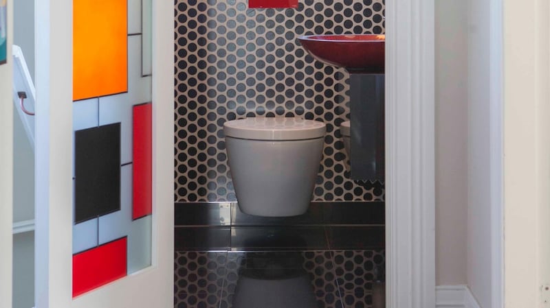 You can also make the door of the bathroom part of its design focus as New Zealand décor firm Nicola Manning Design did with this lead glass design