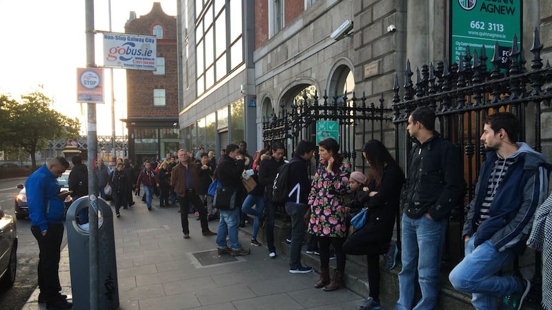 More than 700 people queued outside the Garda National Immigration Bureau from the early hours of Monday morning. Photograph: Sorcha Pollak