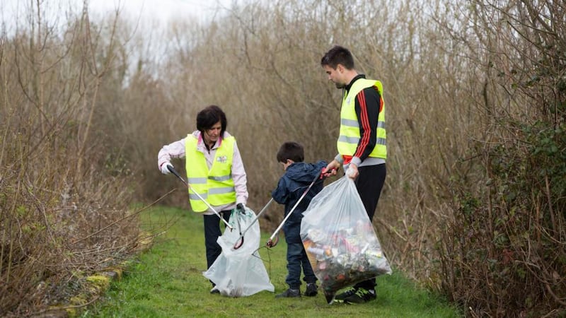 Conor Murray with Limerick clean-up volunteers Lucy and Cian Gibbons near Grove Island, Corbally, Limerick. Photograph: FusionShooters