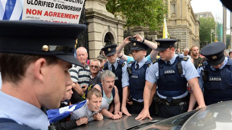 Former minister for justice Alan Shatter’s car is blocked from entering the gates of Leinster House on Wednesday. Photograph: Dara Mac Dónaill