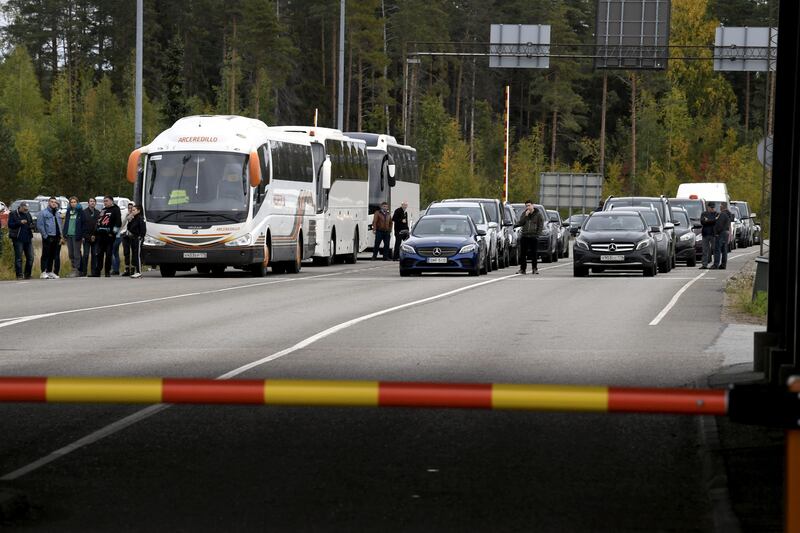 Cars and coaches from Russia queue to cross the border to Finland following Vladimir Putin's mobilisation order in September 2022. Photogrpah: Jussi Nukari/AFP via Getty Images