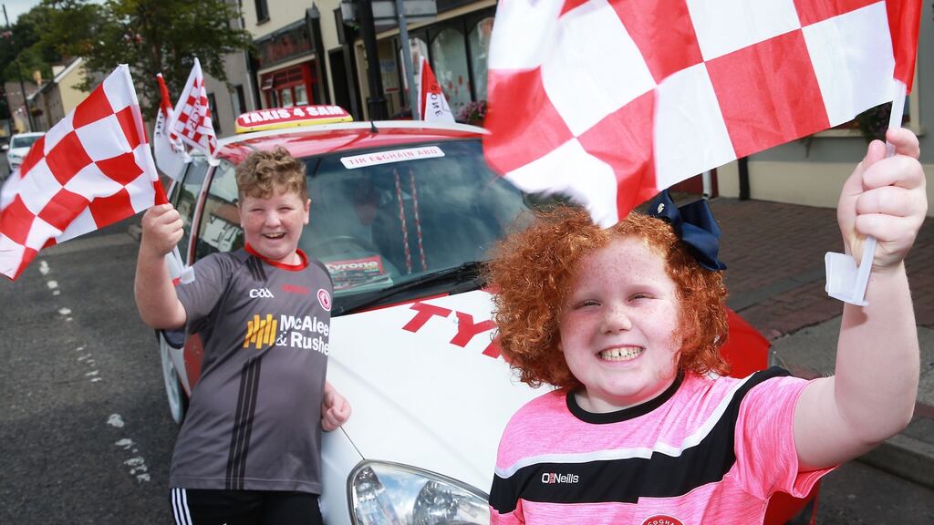 Charlie and Molly Garrity from Trillick, Co Tyrone, cheering on their county ahead of the All Ireland football final on Sunday. Photograph: John McVitty