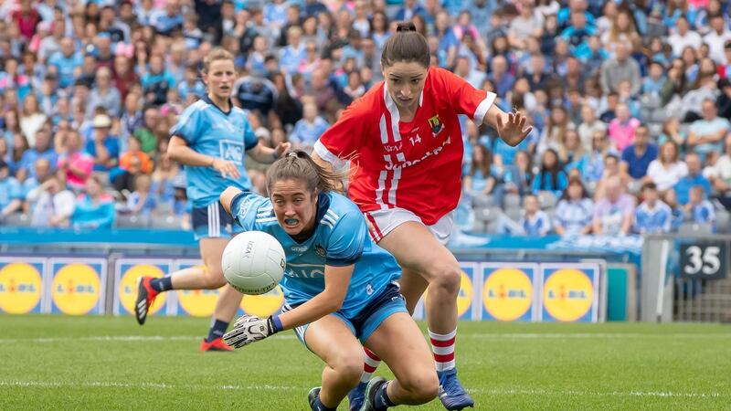 Cork’s Eimear Scally battles with Eabha Rutledge of Dublin. Photo: Morgan Treacy/Inpho