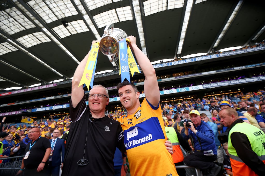 Brian Lohan and Tony Kelly celebrate with the Liam MacCarthy Cup after Clare's win over Cork in a breathtaking All-Ireland final. Photograph: Ryan Byrne/Inpho