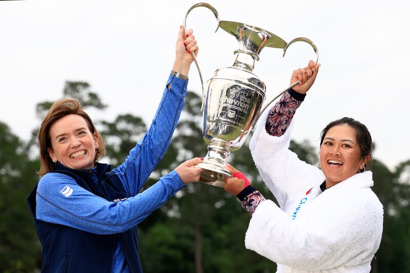 Lilia Vu (right) of the United States lifts the trophy after her victory in the playoff at the Chevron Championship at The Club at Carlton Woods in The Woodlands, Texas. Photograph: Carmen Mandato/Getty Images