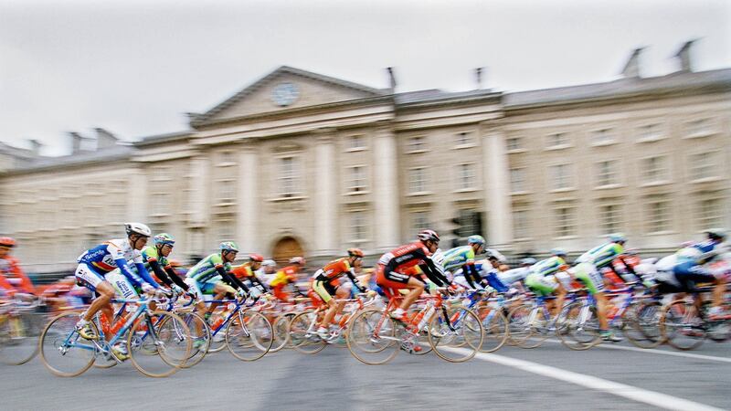 The 1998 Tour de France goes past Trinity College during stage one of the race. Photograph: Bryan O’Brien