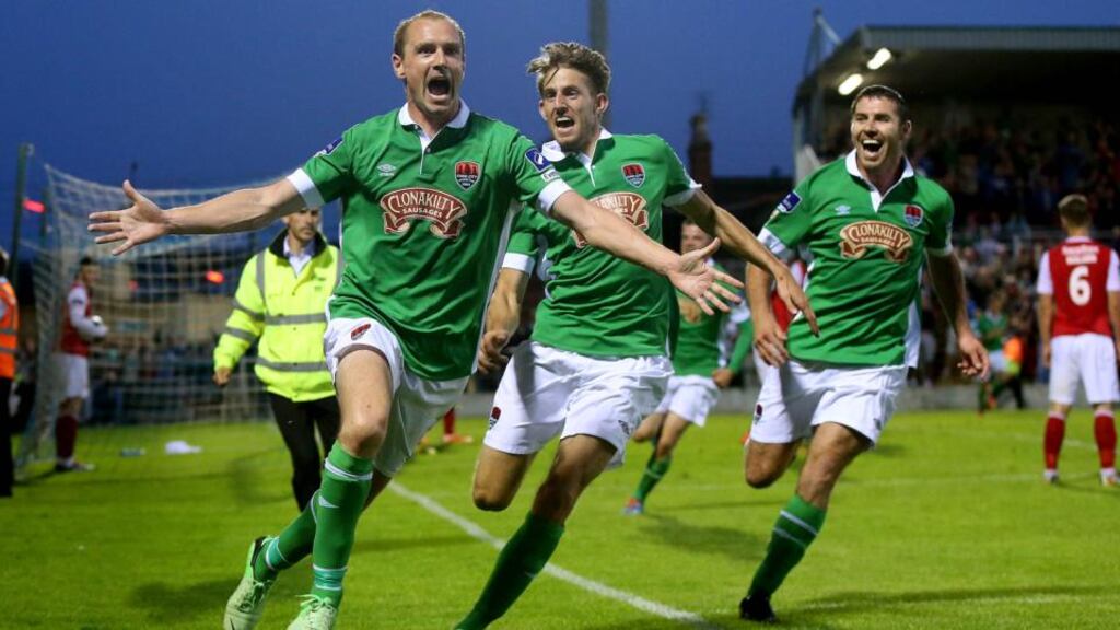 Cork’s Colin Healy celebrates scoring his side’s winning goal against St patrick’s Athletic in the with Michael McSweeney and Mark O’Suullivan at Turner’s Cross. Photograph Inpho.