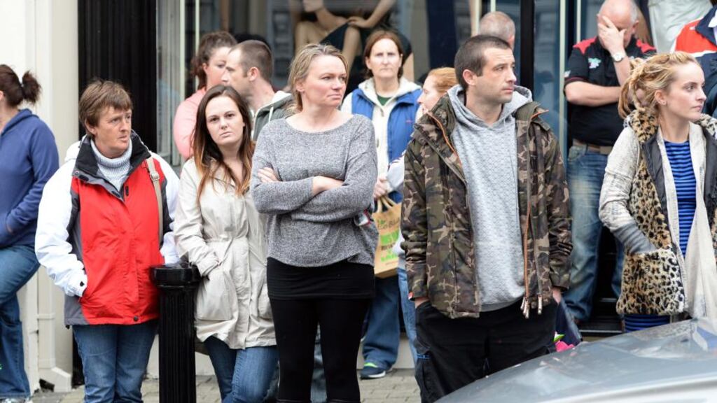 People gather outside Athlone courthouse and Garda station, where a man in his 30s is being held in connection with an alleged serious sexual assault on two girls. Photograph: Eric Luke/The Irish Times