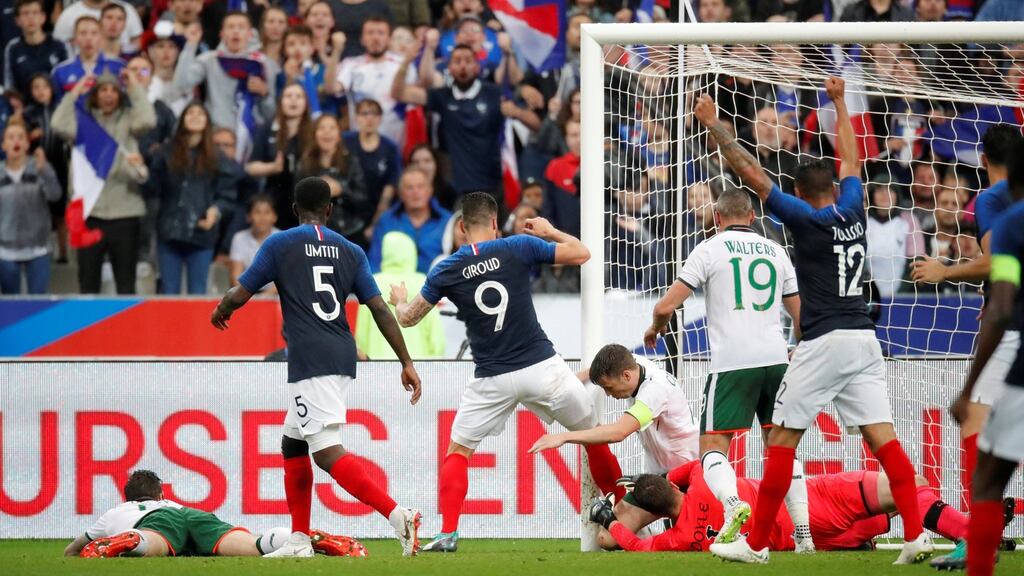 France’s Olivier Giroud scores their first goal during the pre-World Cup friendly win over Ireland. Photo: Charles Platiau/Reuters