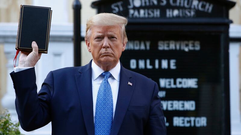 US president Donald Trump holds a Bible outside St John’s Church across Lafayette Park from the White House amide protests in June. Patrick Semansky/AP Photo