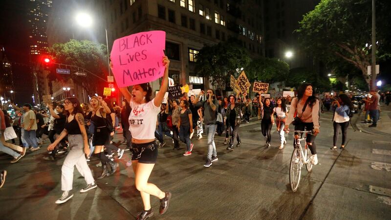 People march in downtown Los Angeles, California US. Photograph: Mario Anzuoni/Reuters