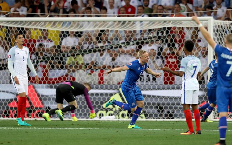 Chris Smalling (left) of England is left dejected after Kolbeinn Sigthorsson of Iceland scores a winning goal past Joe Hart during the Uefa Euro 2016 Round Of 16 match at Stade De Nice on June 27th, 2016 in Nice, France. Photograph: Richard Sellers/Sportsphoto/Allstar/Getty
