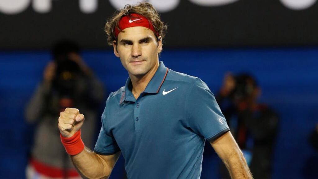 Roger Federer of Switzerland celebrates after winning his fourth round match against Jo-Wilfried Tsonga of France at the Australian Open Grand Slam   in Melbourne. Photograph: Made Nagi/EPA