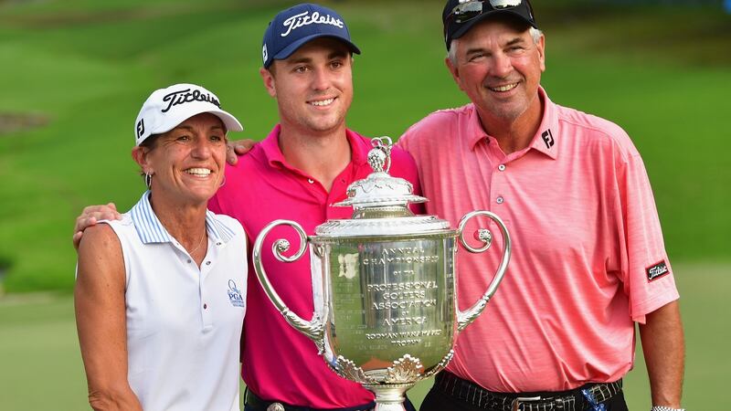 Justin Thomas with parents Jani and Mike after winning the US PGA Championship. Photograph:Stuart Franklin/Getty
