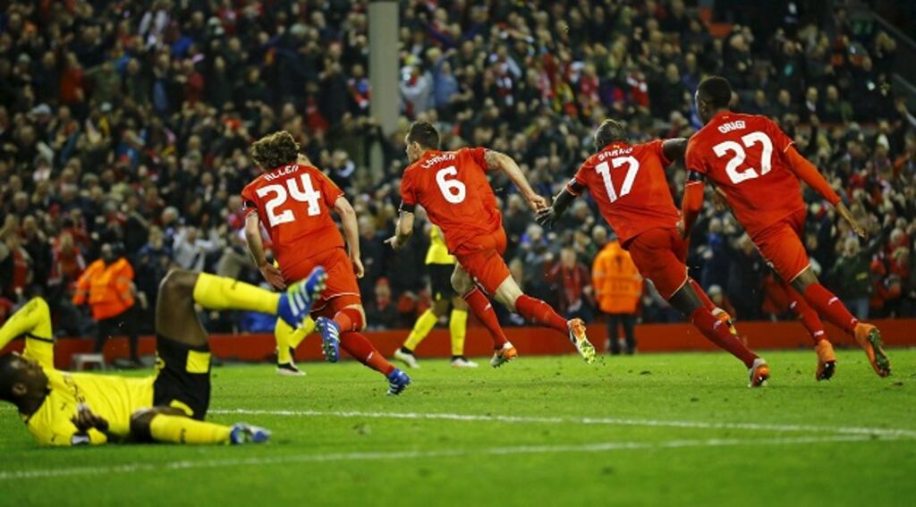 Liverpool's Dejan Lovren celebrates with teammates after scoring in front of The Kop in injury time to secure a memorable 4-3 victory. Photograph: Darren Staples/Reuters