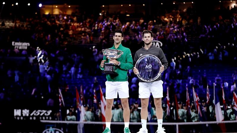 Novak Djokovic with Dominic Thiem after their five-set final in Melbourne. Photograph: Lynn Bo Bo/EPA