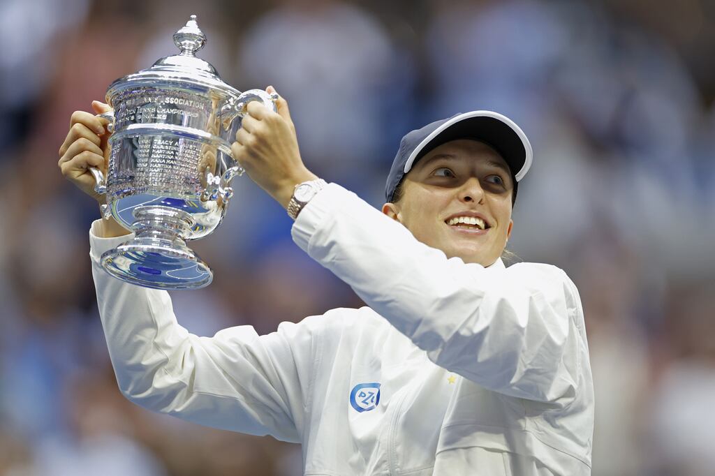 Iga Swiatek of Poland celebrates with the championship trophy after defeating Ons Jabeur of Tunisia during the women’s singles final of the 2022 US Open. Photograph: Sarah Stier/Getty Images
