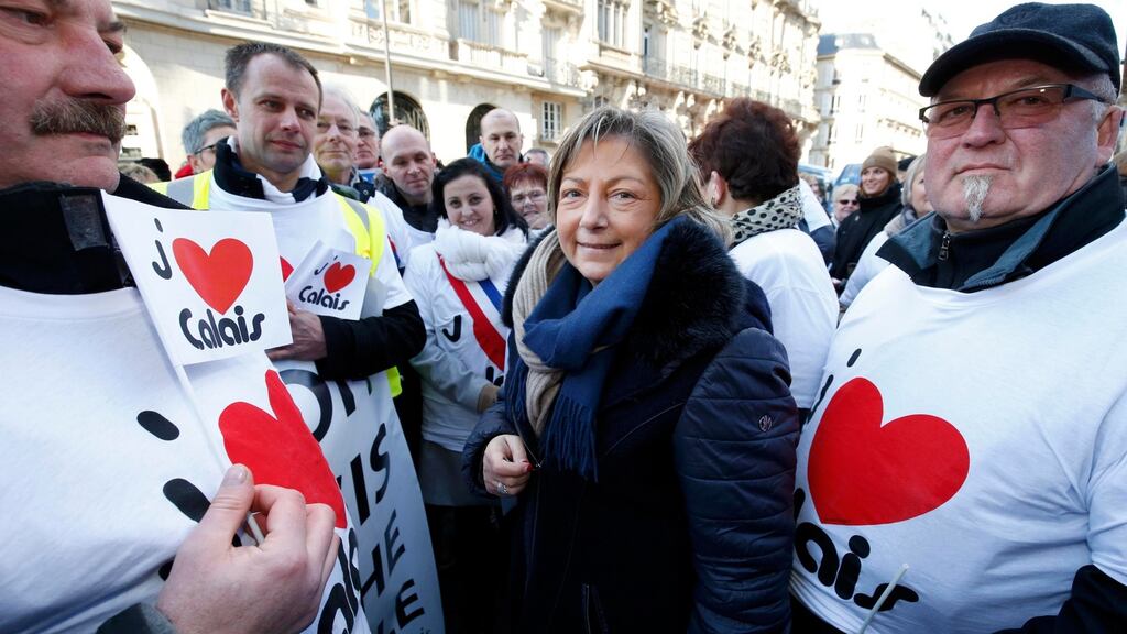 Calais mayor Natacha Bouchart (centre) and residents of Calais protest to urge the government to help their failing businesses and restore the image of the town affected by the migrant crisis. Photograph:  Philippe Wojazer/Reuters