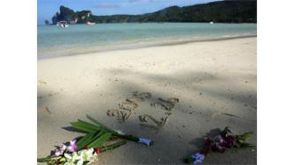 Flowers laid on a beach on the island of Phi Phi during yesterday's memorial ceremony for the thousands who died in last year's tsunami