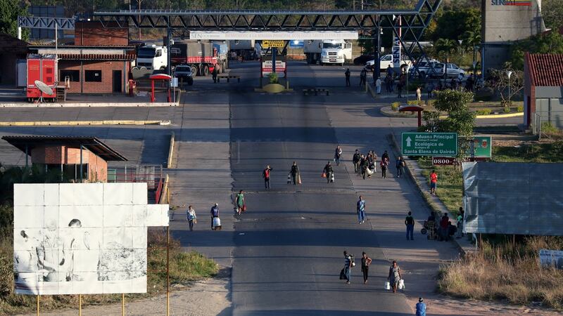 People cross the border from Venezuela to Brazil in Pacaraima, Brazil. Photograph: Reuters/Ricardo Moraes