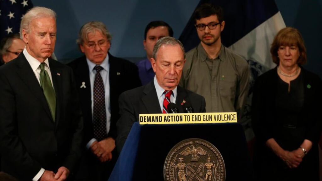 New York City mayor Michael Bloomberg with US vice-president Joseph Biden (left) and family members of victims of Sandy Hook school shooting. Photograph: Brendan McDermid/Reuters