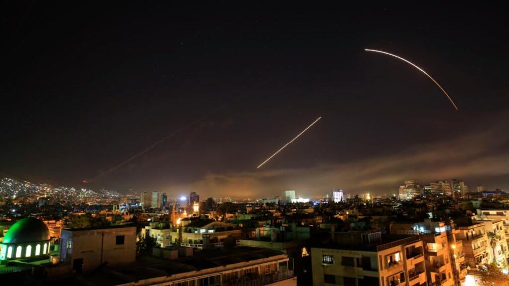 Syrian air strike: missiles streak across Damascus early on Saturday. Photograph: Hassan Ammar/AP