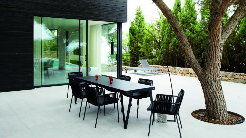 Mature trees in the surrounding setting can be woven into the look and feel of the house. The one looks like its growing up through the terrace