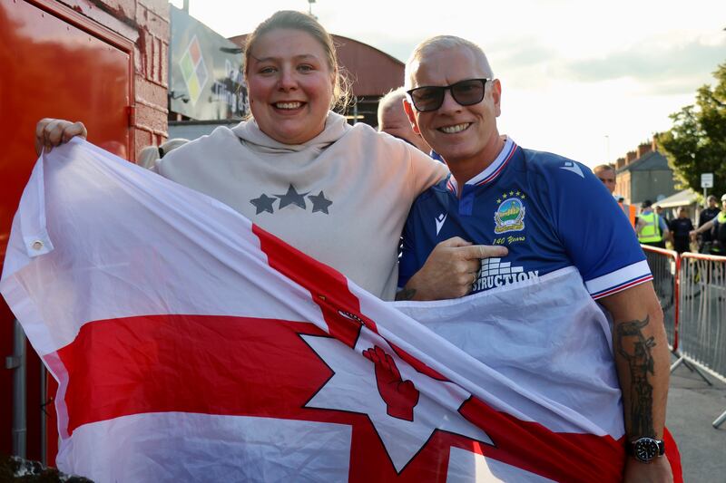 Linfield fans Lauren and John, with the Northern Ireland flag at the game against Shelbourne.