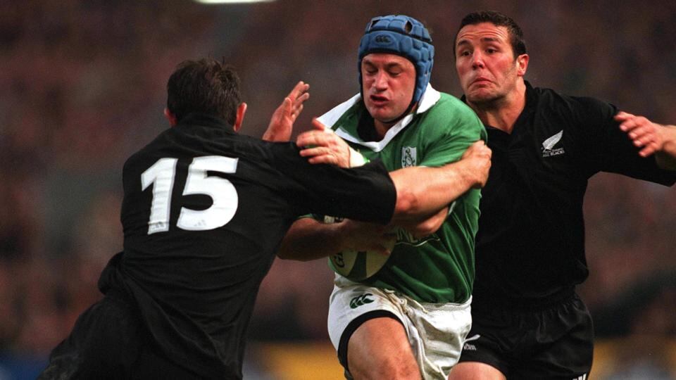 David Humphreys of Ireland is tackled by Leon McDonald and Aaron Mauger of New Zealand. Photograph: Patrick Bolger/Inpho