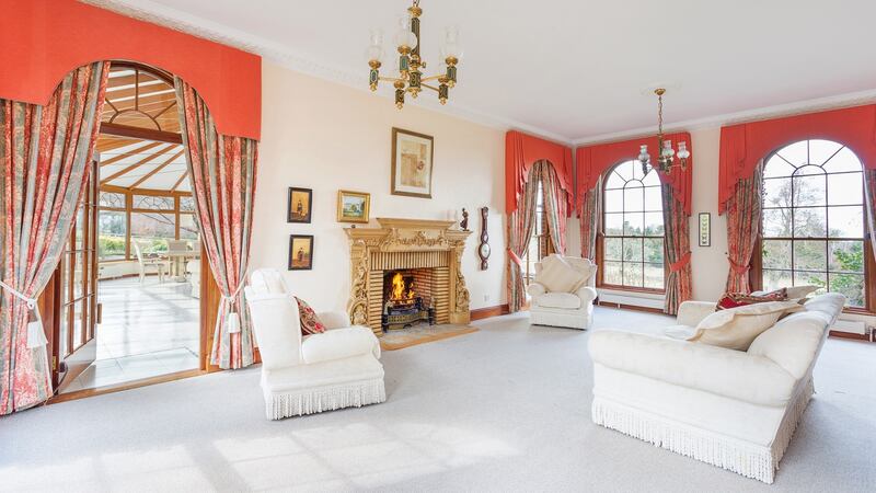 The drawing room overlooks lawns on three sides of the house