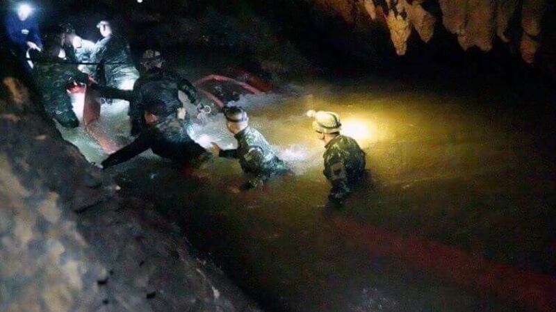 Thai rescue teams walk inside cave complex where 12 boys and their soccer coach went missing, in Mae Sai, Chiang Rai province, in northern Thailand. Photograph: AP