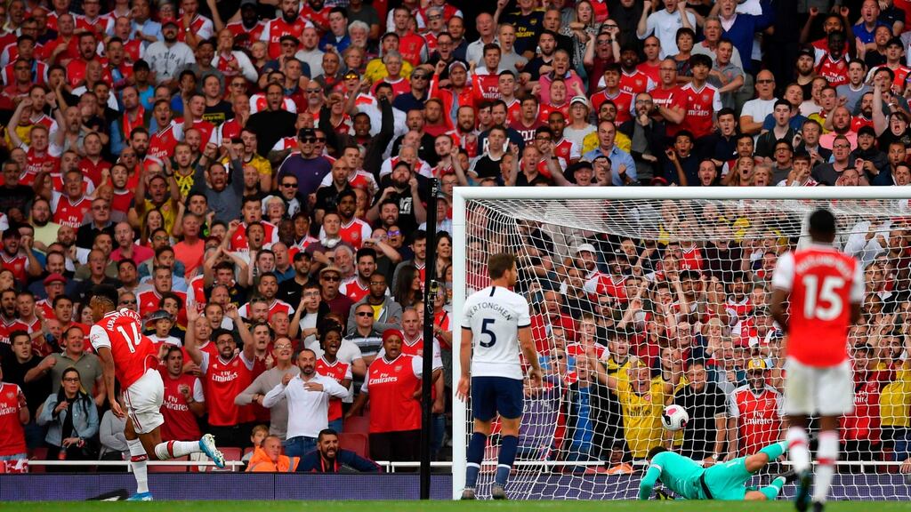 Pierre-Emerick Aubameyang scores Arsenal’s equaliser against Spurs. Photograph: Ben Stansall/AFP/Getty