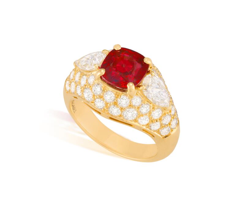 A Bulgari ring with a cushion-shaped Burmese ruby, and two pear-shaped diamonds with a cut-diamond surround