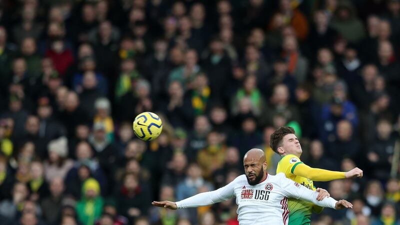Sheffield United’s David McGoldrick battles for possession with Sam Byram of Norwich City. Photograph: Naomi Baker/Getty Images