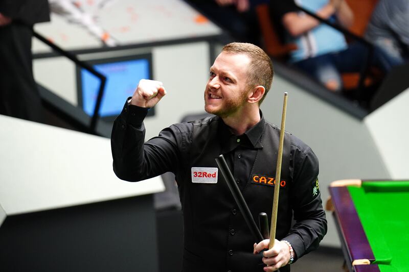 Mark Allen celebrates after beating Jak Jones on day twelve of the Cazoo World Snooker Championship at the Crucible Theatre, Sheffield. Photograph: Zac Goodwin/PA