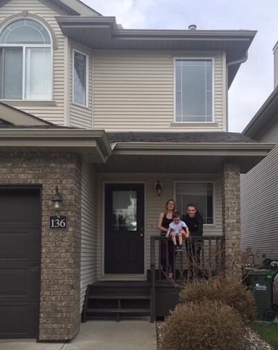 Katie Kiernan with her partner Shane and son Nathan outside their new home.