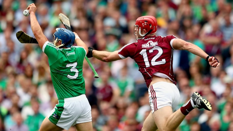 Limerick’s Mike Casey beats Galway’s Jonathan Glynn to the ball at Croke Park.   Photograph: James Crombie/Inpho