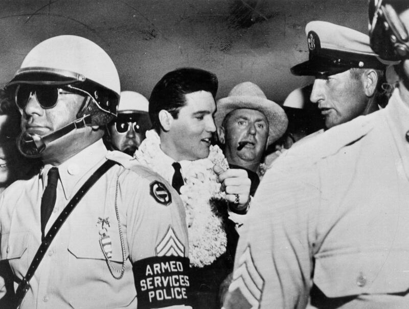 Elvis Presley and his manager Colonel Tom Parker in Hawaii, March 1961. Photograph: Michael Ochs Archives/Getty Images