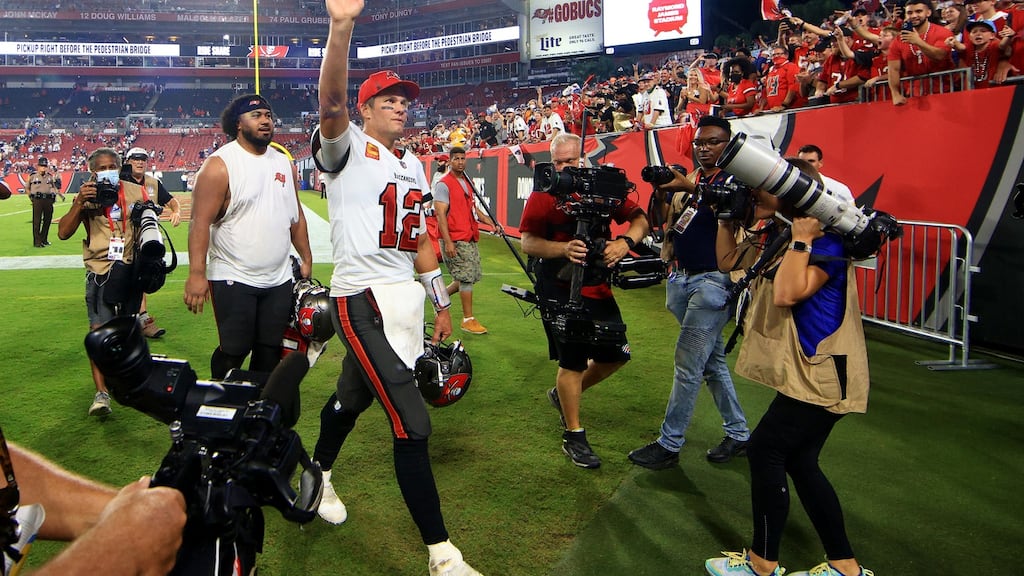 Tom Brady of the Tampa Bay Buccaneers waves to fans after defeating the Dallas Cowboys 31-29 at Raymond James Stadium. Photo: Mike Ehrmann/Getty Images