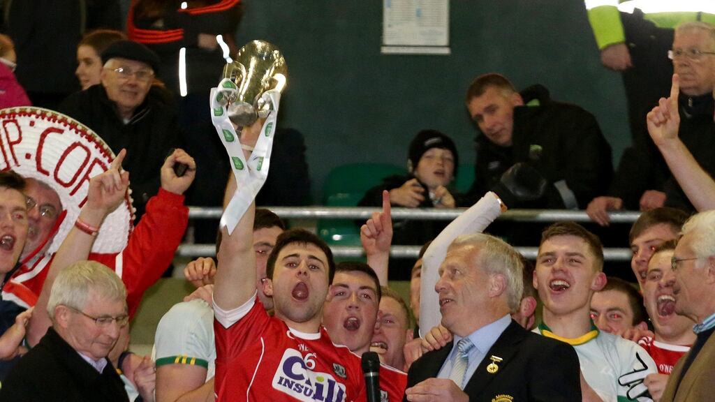 Cork’s Stephen Cronin lifts the trophy after his side beat Kerry in the Munster under-21 football championship. Photo: Ryan Byrne/Inpho